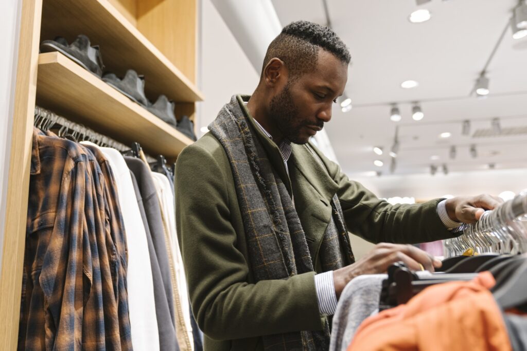 Stylish man shopping in a clothes store